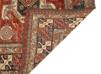 Lot 324 - A tribal carpet