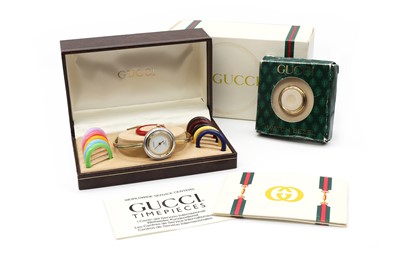 Lot 338 - A ladies' gold plated Gucci quartz bangle watch