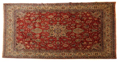 Lot 329 - A large wool Heriz carpet