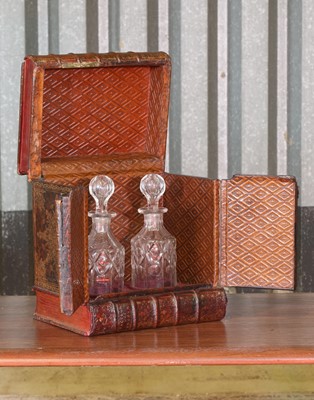 Lot 18 - A leather faux book decanter case
