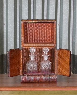 Lot 18 - A leather faux book decanter case