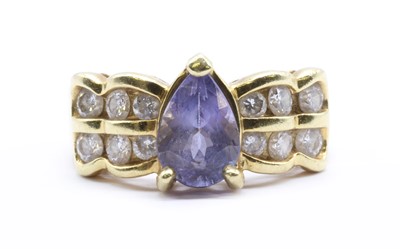 Lot 179 - A gold tanzanite and diamond ring