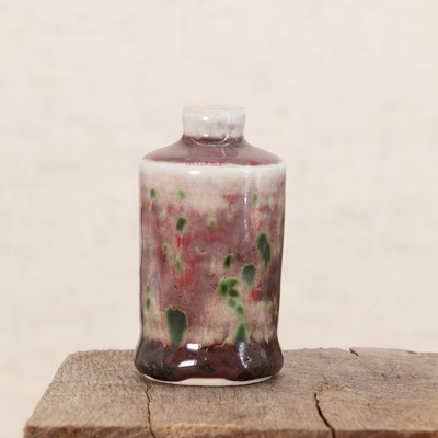 Lot 142 - A Chinese peachbloom-glazed snuff bottle