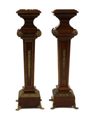 Lot 415 - A pair of Louis XV-style walnut torcheres