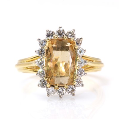 Lot 235 - An 18ct two colour gold topaz and diamond cluster ring, by Boodle and Dunthorne, c.1980