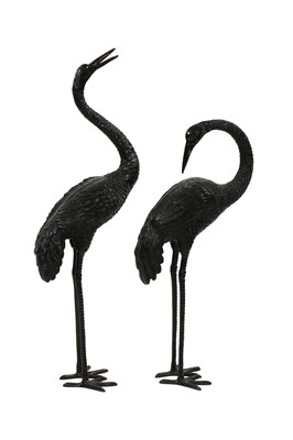 Lot 458 - A pair of patinated metal garden cranes