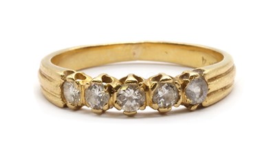 Lot 54 - A gold five stone ring