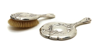 Lot 7 - A silver-mounted mirror and hair brush
