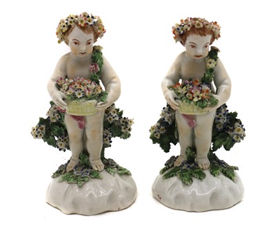 Lot 45 - A pair of Royal Crown Derby porcelain putti