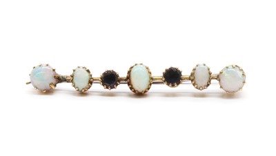 Lot 20 - A 9ct gold opal and sapphire bar brooch