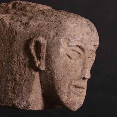 Lot 208 - A Celtic sandstone head with bared teeth