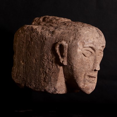 Lot 208 - A Celtic sandstone head with bared teeth