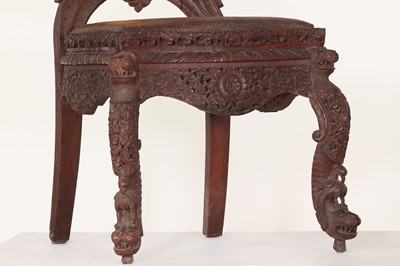Lot 46 - A pair of carved teak chairs