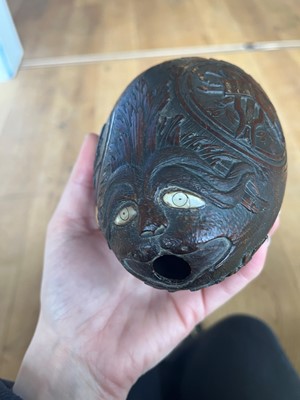 Lot 101 - A carved 'bugbear' coconut flask