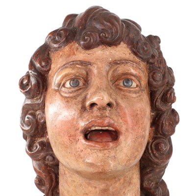 Lot 145 - A life-size terracotta sculptured head of a singing angel