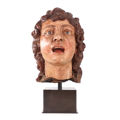 Lot 145 - A life-size terracotta sculptured head of a singing angel