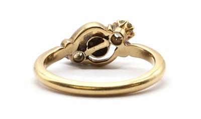 Lot 10 - A gold three stone cultured pearl and diamond ring