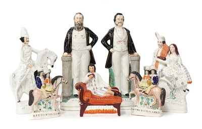 Lot 203 - A group of twenty Staffordshire porcelain figures