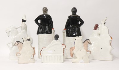 Lot 203 - A group of twenty Staffordshire porcelain figures