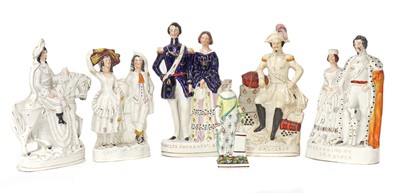 Lot 203 - A group of twenty Staffordshire porcelain figures