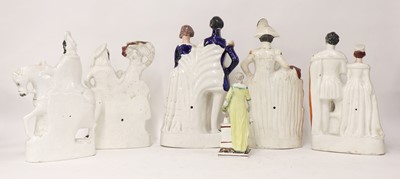 Lot 203 - A group of twenty Staffordshire porcelain figures