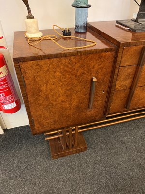 Lot 228 - An Art Deco burr walnut dining suite