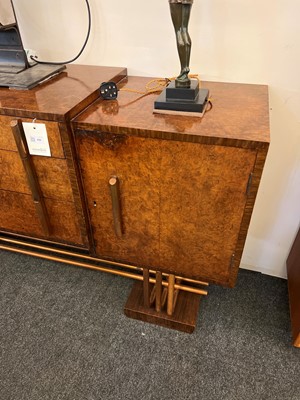 Lot 228 - An Art Deco burr walnut dining suite