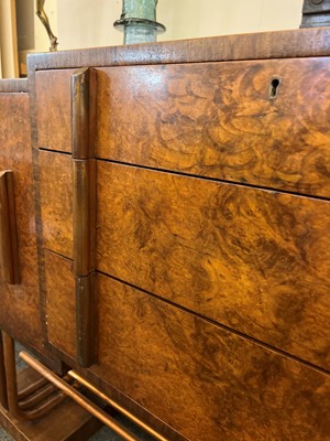 Lot 228 - An Art Deco burr walnut dining suite