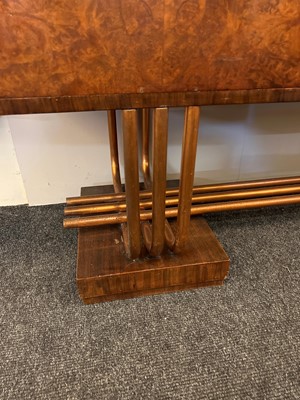 Lot 228 - An Art Deco burr walnut dining suite