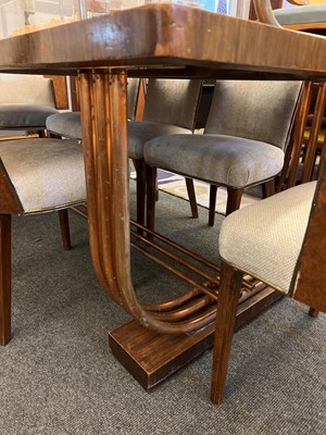 Lot 228 - An Art Deco burr walnut dining suite