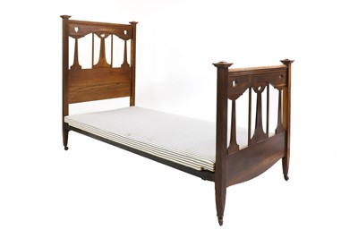 Lot 588 - An Arts and Crafts oak single bed