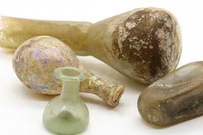 Lot 247 - A collection of Roman glass vessels
