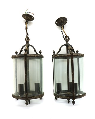 Lot 460 - A pair of George III style three light hall lanterns