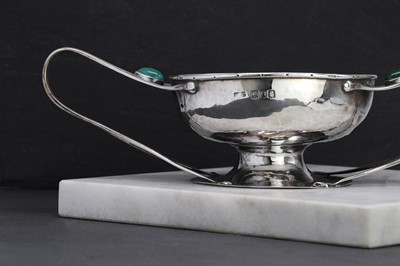 Lot 79 - An Arts and Crafts silver twin-handled porringer