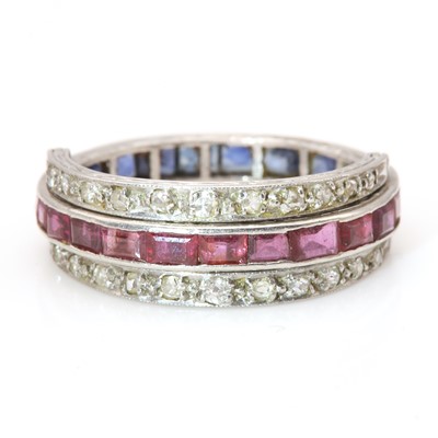 Lot 112 - An Art Deco ruby, sapphire and diamond swivel or flip eternity ring