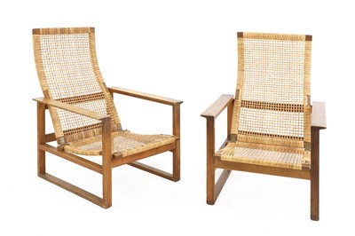 Lot 382 - A pair of Danish 'Model 2254' reclining oak armchairs
