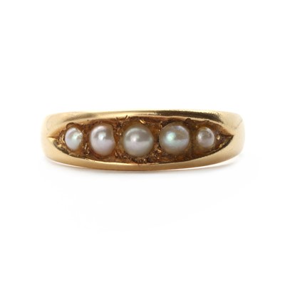 Lot 1028 - A gold five stone split pearl ring