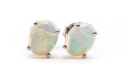 Lot 223 - A pair of silver single stone opal stud earrings