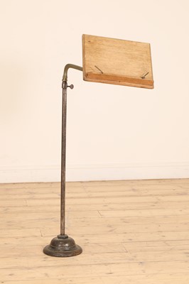 Lot 434 - A brass and oak music stand