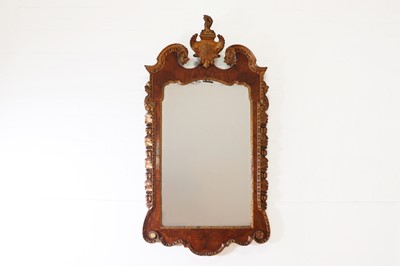 Lot 86 - A George II-style walnut and parcel-gilt pier mirror