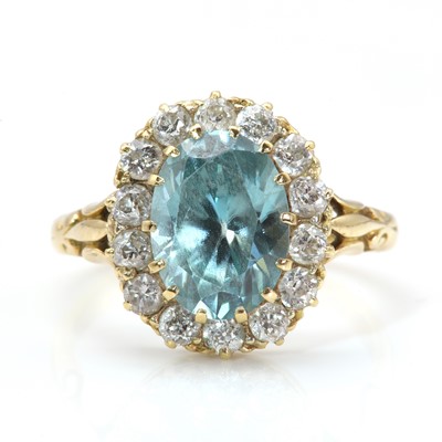 Lot 231 - An Edwardian gold blue zircon and diamond cluster ring