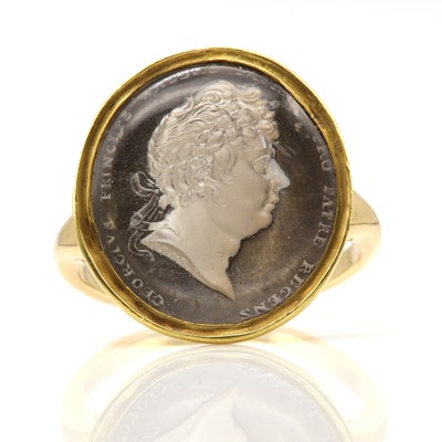 Lot 4 - A George IV gold, glass cameo sulphide ring, by Rundell, Bridge & Rundell, c.1815