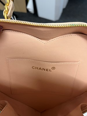 Lot 1452 - A Chanel pink leather heart bag