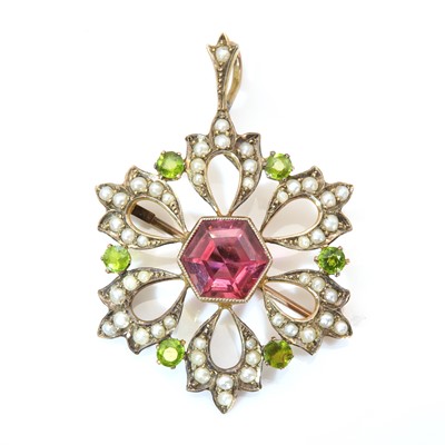 Lot 75 - An Edwardian pink tourmaline, demantoid garnet and split pearl pendant/brooch, c.1900