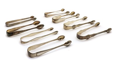 Lot 37 - A collection of eight George III and later silver sugar tongs