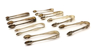 Lot 37 - A collection of eight George III and later silver sugar tongs