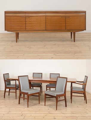 Lot 603 - An Alfred Cox walnut and teak dining suite