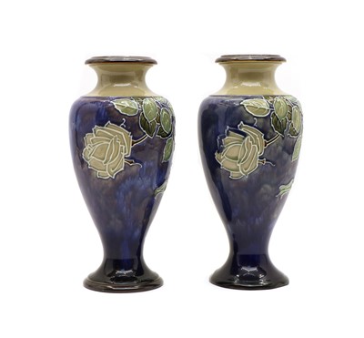 Lot 197 - A pair of Royal Doulton stoneware Roses pattern vases