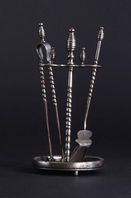 Lot 177 - A set of miniature polished steel fire irons and stand