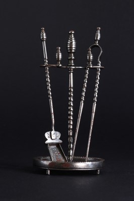 Lot 177 - A set of miniature polished steel fire irons and stand